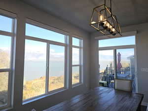 Dining area featuring a Lake and mountain view
