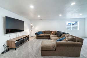 Spacious family room downstairs with nice resessed lighting