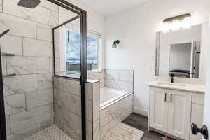 Glass shower and soaker tub combo in this perfect master bathroom