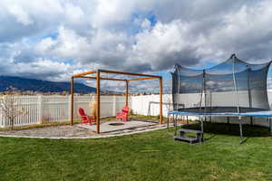 Great firepit to enjoy this fully fenced backyard with wonderful mountain views