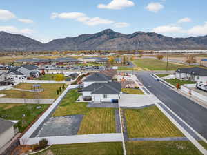 Aerial perspective of subject neighborhood with a mountain background