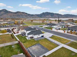 Aerial perspective of subject neighborhood with a mountain background