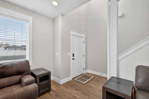 Foyer featuring wood finished floors and recessed lighting