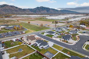 Aerial perspective of subject neighborhood with a mountain background