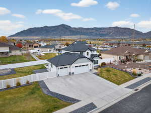 Aerial perspective of subject neighborhood with a mountain background