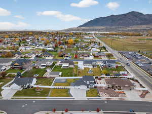 Aerial perspective of subject neighborhood with a mountain background