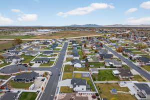 Aerial perspective of subject neighborhood with a mountain background