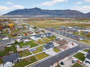 Aerial perspective of subject neighborhood with a mountain background