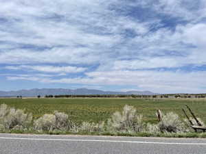 View of mountain background with rural landscape and agricultural land