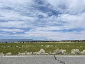 View of mountain backdrop with rural landscape