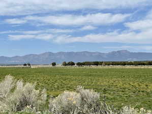 View of mountain background featuring rural landscape and agricultural land