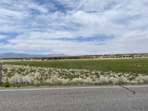 View of mountain backdrop featuring rural landscape