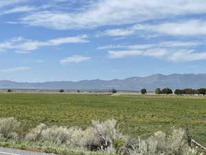 View of mountain background featuring rural landscape