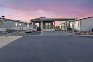 Manufactured / mobile home featuring concrete driveway