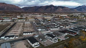 Aerial view of residential area featuring a mountainous background
