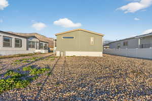 Rear view of property with a mountain view