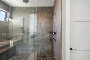 Full bathroom featuring tiled shower