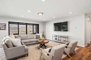 Living room featuring wood finished floors and recessed lighting