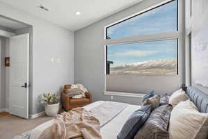Carpeted bedroom with baseboards and recessed lighting
