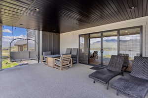 View of patio featuring a water view