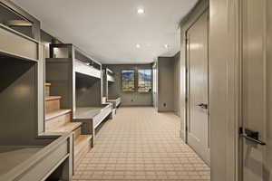 Corridor featuring light colored carpet and recessed lighting