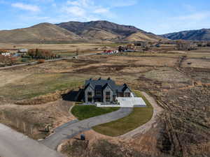 View of mountain backdrop with rural landscape