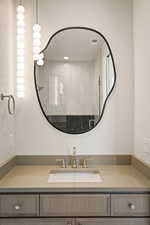 Full bathroom featuring vanity and a tile shower