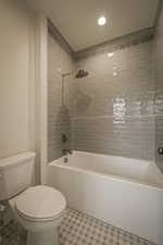 Full bathroom featuring tub / shower combination and recessed lighting