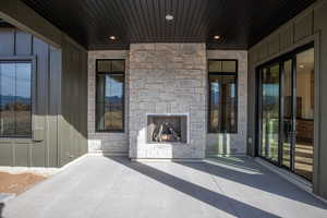 View of patio with a fireplace
