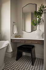 Bathroom featuring vanity and a freestanding tub