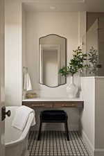 Bathroom with vanity and a soaking tub