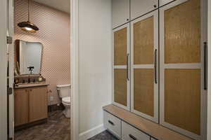 Bathroom featuring vanity and toilet