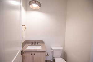Half bath with vanity and toilet