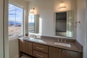 Bathroom with double vanity and a mountain view