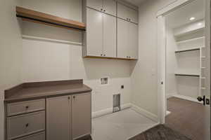 Laundry room with washer hookup, hookup for an electric dryer, and cabinet space