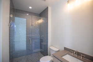Bathroom with vanity and a shower stall