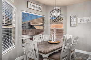 Dining area featuring a chandelier and wood finished floors