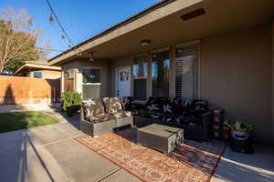 View of patio with an outdoor hangout area