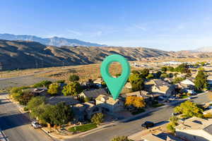 Aerial perspective of suburban area featuring a mountain backdrop