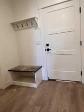 Mudroom featuring dark wood-style floors