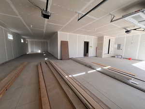 Garage with a garage door opener and electric panel