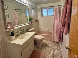 Full bath with vanity and shower / bath combo