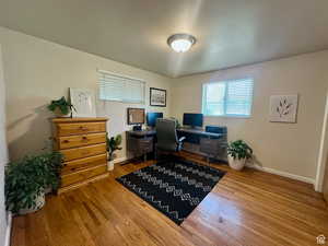 Office featuring baseboards and light wood-style flooring