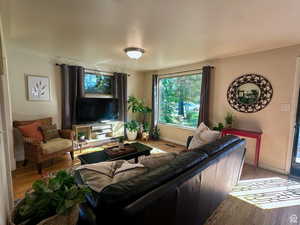 Living area featuring wood finished floors and healthy amount of natural light