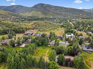 Aerial perspective of suburban area with a mountain backdrop
