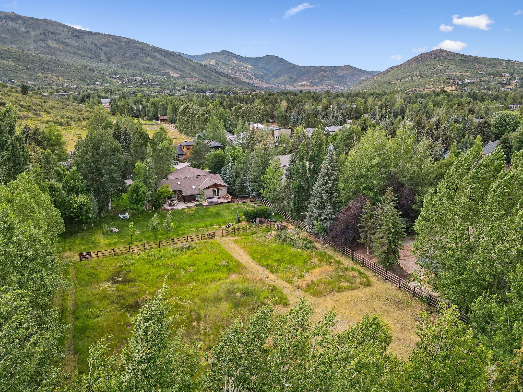 Aerial view of sparsely populated area featuring a mountainous background