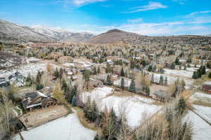 Snowy aerial view with a mountain view