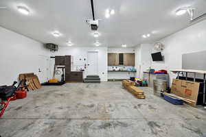 Garage with a heating unit and a garage door opener