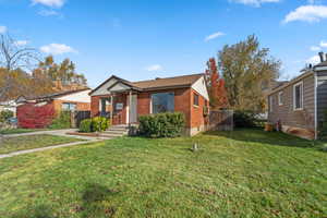 Bungalow-style house featuring brick siding
