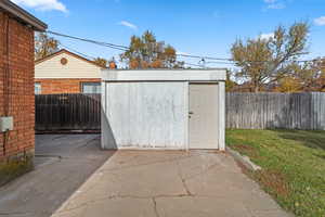 View of shed featuring a fenced backyard
